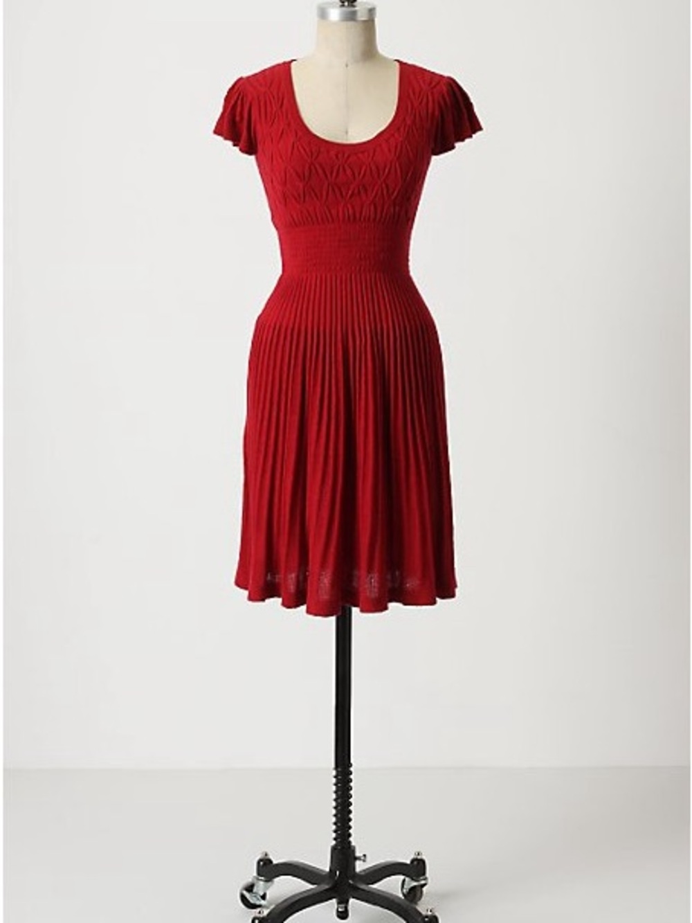 Sparrow dress featuring a textured smocked bodice and short flutter sleeves L